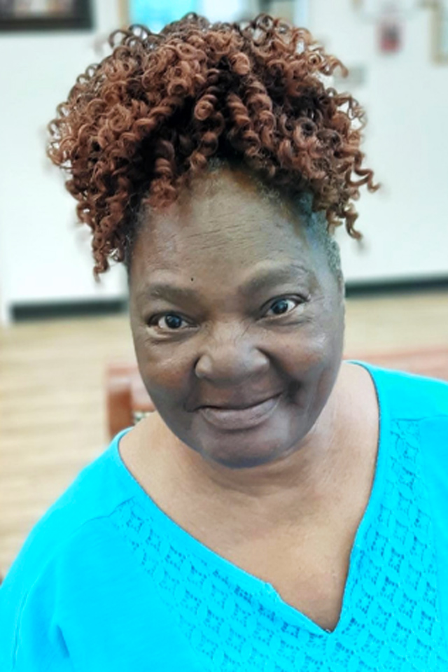 Thrive adult day health care member Priscilla in blue blouse smiling